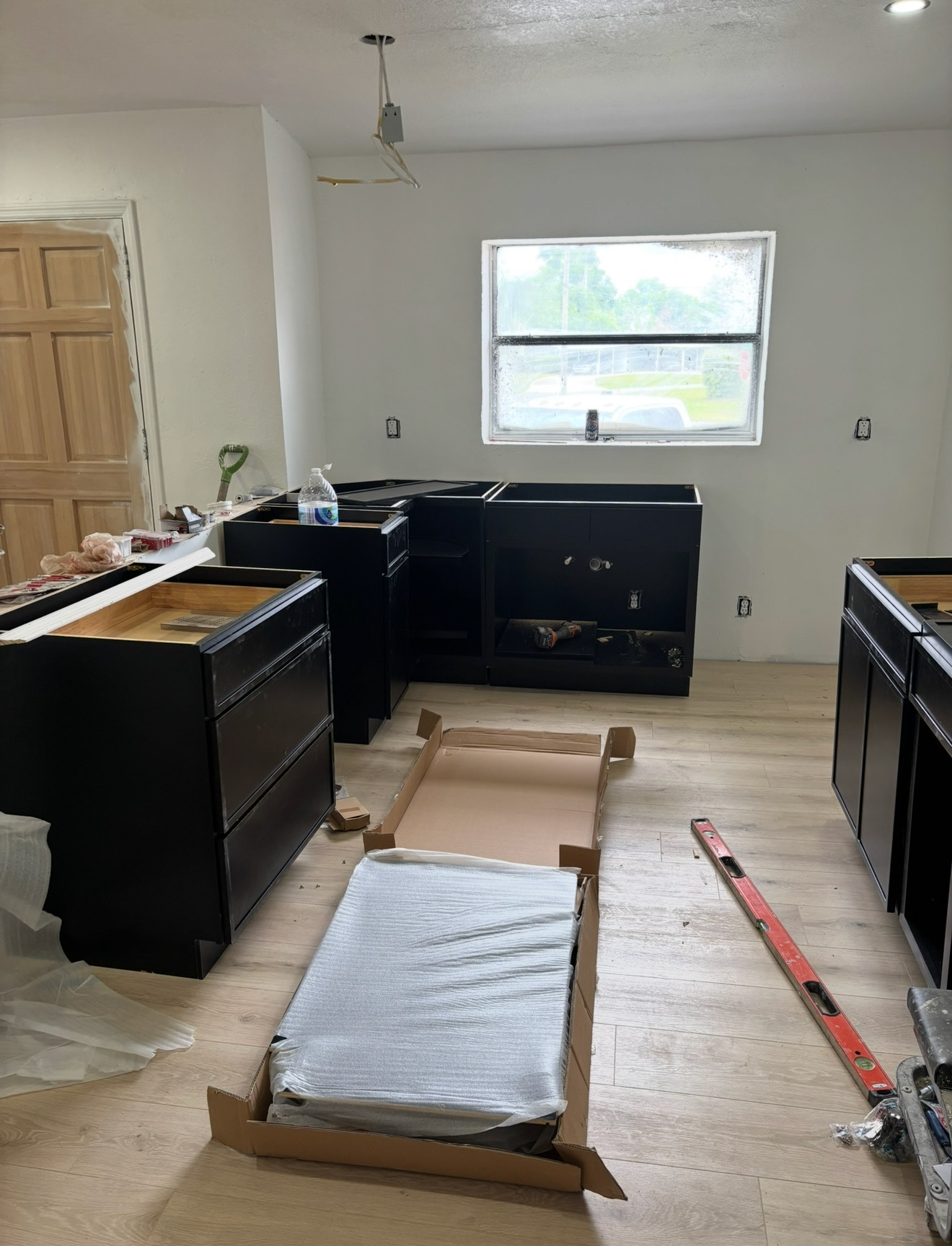 Luxury vinyl plank and black cabinets